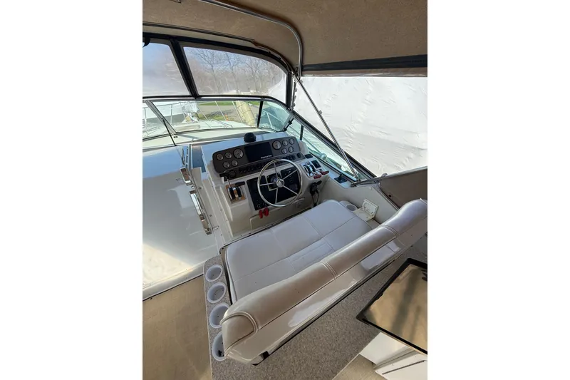 Slide: The Image of Interior helm of 1992 Wellcraft 3400 Gran Sport boat with steering wheel and controls. - 9