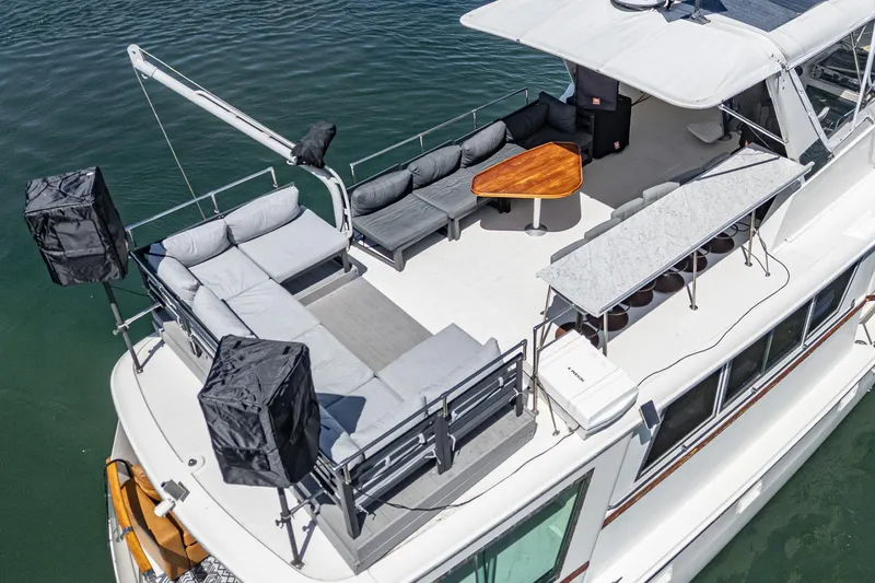 Slide: The Image of Aerial view of 1979 Hatteras 58 Motor Yacht with spacious deck and seating area. - 14