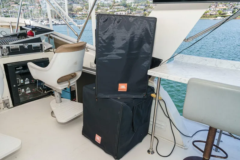 Slide: The Image of 1979 Hatteras 58 Motor Yacht helm with JBL speaker, chair, and control panel. - 24