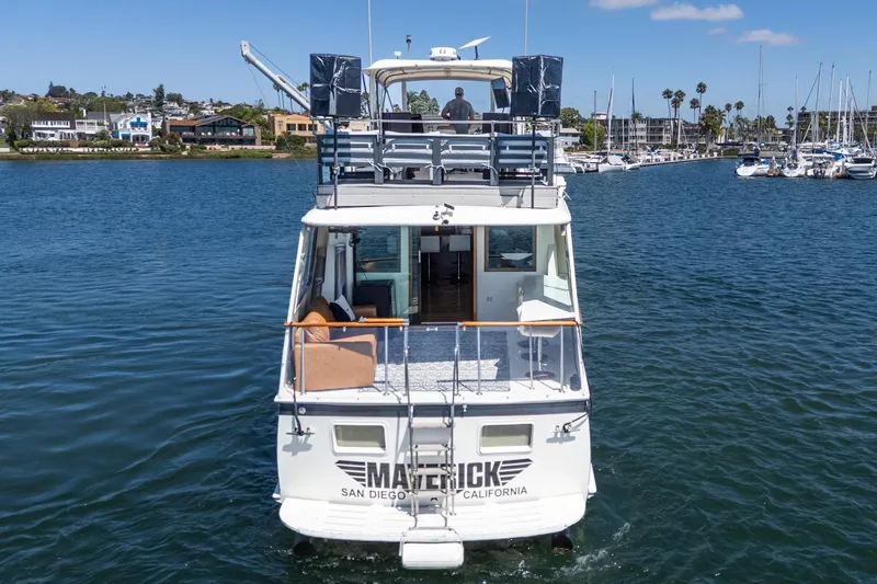 Slide: The Image of 1979 Hatteras 58 Motor Yacht cruising in San Diego harbor, sunny day, clear skies. - 28