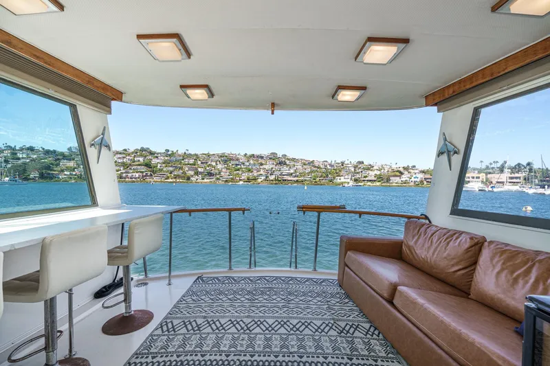 Slide: The Image of Interior of 1979 Hatteras 58 Motor Yacht with scenic waterfront view. - 33