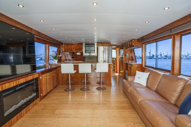 Slide: The Image of Luxurious interior of 1979 Hatteras 58 Motor Yacht with modern kitchen and seating area. - 35