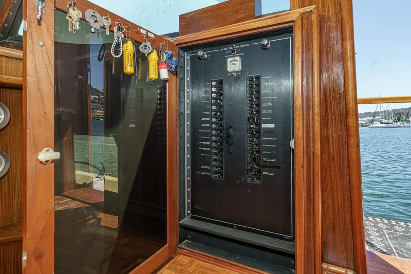 Slide: The Image of Electrical panel on a 1979 Hatteras 58 Motor Yacht with key storage. - 46