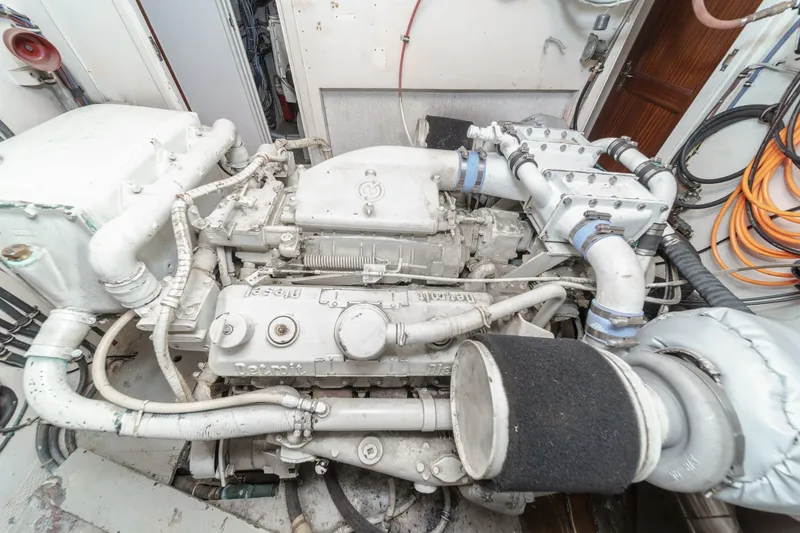 Slide: The Image of Engine room of a 1979 Hatteras 58 Motor Yacht, showcasing detailed machinery. - 69