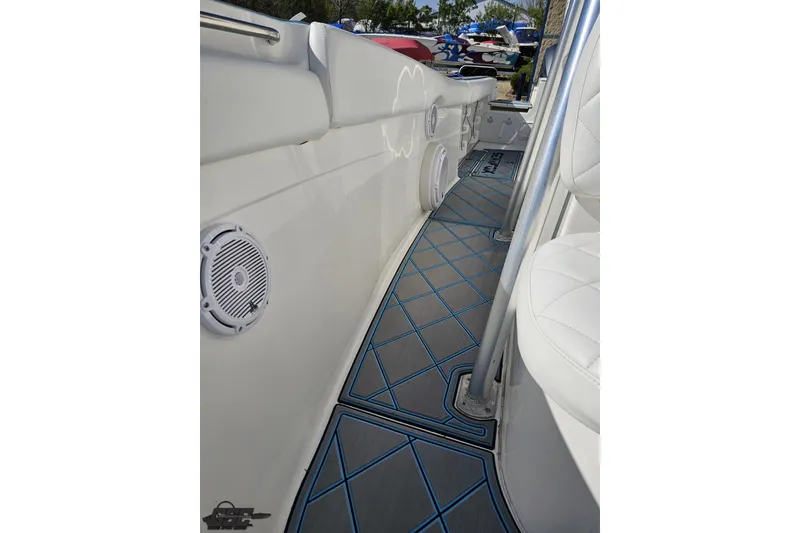Slide: The Image of 2013 Sea Fox 286 Commander boat interior with cushioned seating and marine speakers. - 104