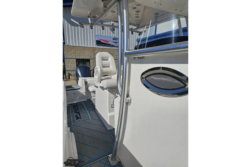 Slide: The Image of 2013 Sea Fox 286 Commander boat interior with seating and control panel. - 105