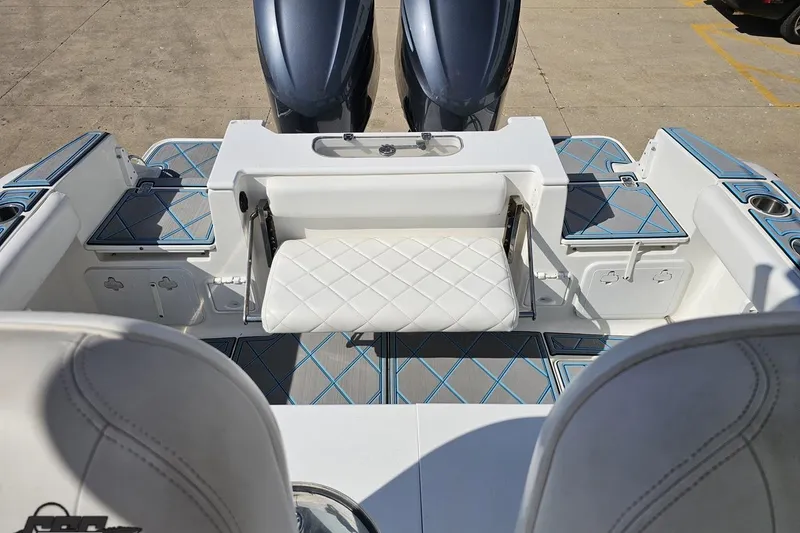 Slide: The Image of 2013 Sea Fox 286 Commander boat interior with seating and dual engines. - 109
