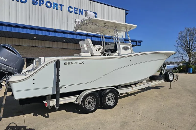 Slide: The Image of 2013 Sea Fox 286 Commander boat on trailer outside dealership. - 11