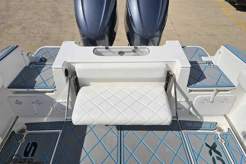Slide: The Image of 2013 Sea Fox 286 Commander boat with dual engines and cushioned seating. - 110