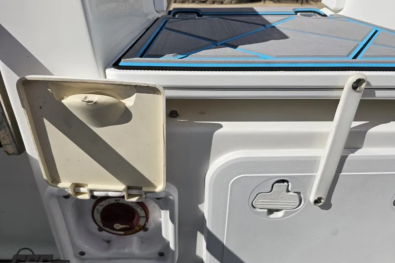 Slide: The Image of 2013 Sea Fox 286 Commander boat detail showing storage compartment and deck. - 115
