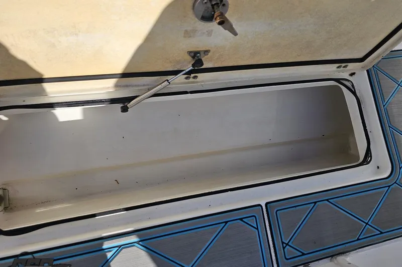 Slide: The Image of Open storage compartment on a 2013 Sea Fox 286 Commander boat. - 116
