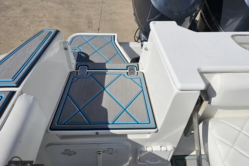 Slide: The Image of 2013 Sea Fox 286 Commander boat deck with blue and gray non-slip flooring. - 117