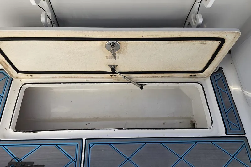 Slide: The Image of Open storage compartment on a 2013 Sea Fox 286 Commander boat. - 119