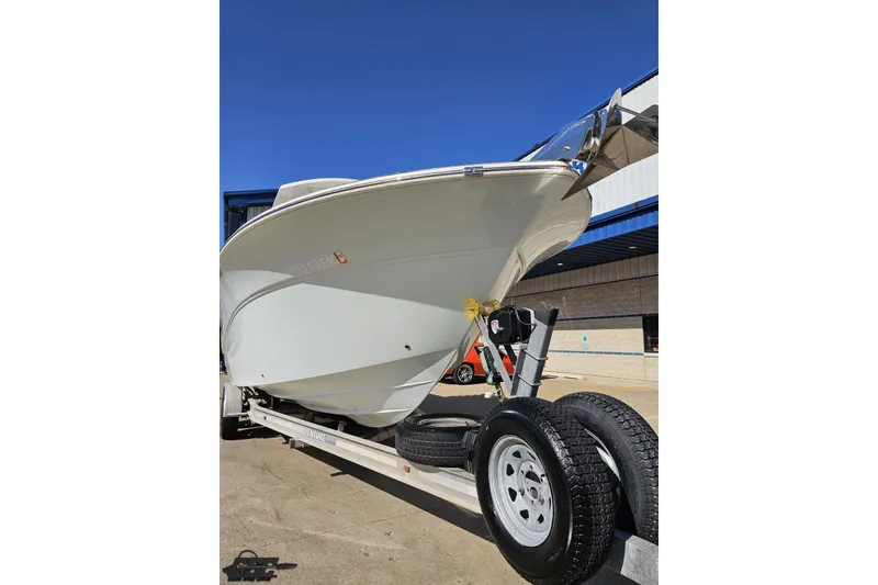 Slide: The Image of 2013 Sea Fox 286 Commander boat on trailer under clear blue sky. - 15