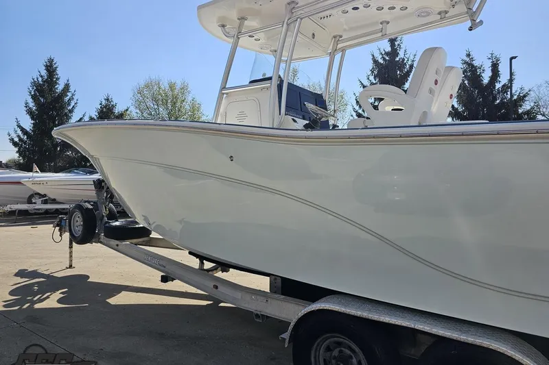 Slide: The Image of 2013 Sea Fox 286 Commander boat on trailer, side view, outdoors. - 26