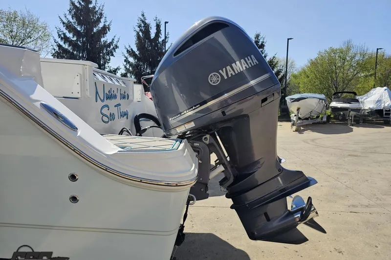 Slide: The Image of 2013 Sea Fox 286 Commander with Yamaha outboard motor in a sunny outdoor setting. - 29
