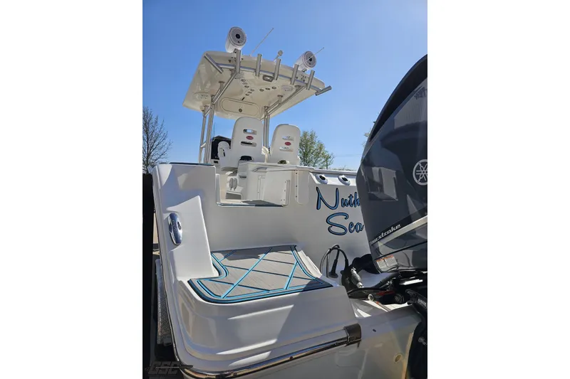 Slide: The Image of 2013 Sea Fox 286 Commander boat with Yamaha outboard motor, viewed from the stern. - 31