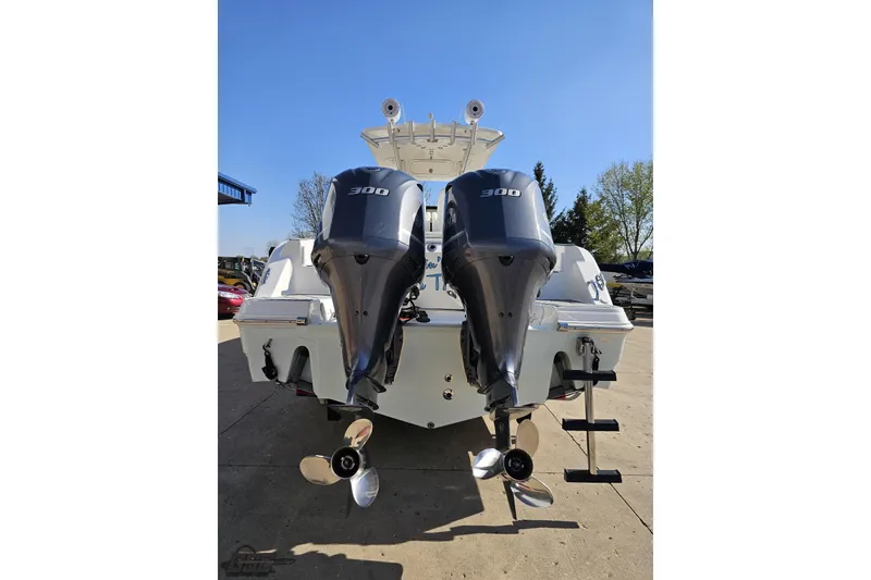 Slide: The Image of 2013 Sea Fox 286 Commander boat with dual 300 horsepower engines, docked outdoors. - 33