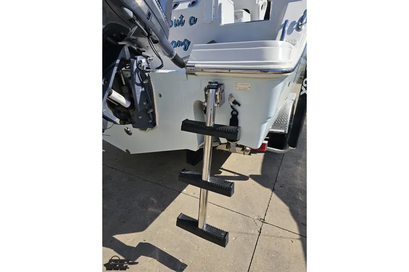 Slide: The Image of 2013 Sea Fox 286 Commander boat with foldable swim ladder and motor mount. - 36