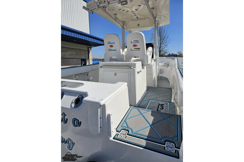 Slide: The Image of 2013 Sea Fox 286 Commander boat interior with seating and storage compartments. - 38