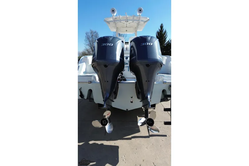 Slide: The Image of 2013 Sea Fox 286 Commander with dual 300 horsepower outboard engines, rear view. - 39