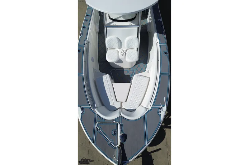 Slide: The Image of 2013 Sea Fox 286 Commander boat interior with cushioned seating and sleek design. - 47