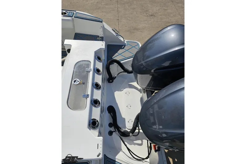 Slide: The Image of 2013 Sea Fox 286 Commander boat with dual engines and fishing rod holders. - 49