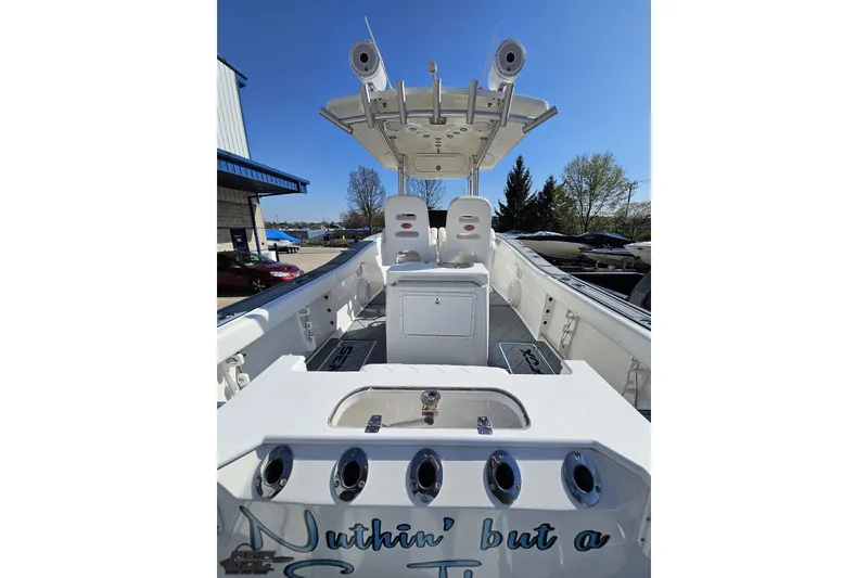 Slide: The Image of 2013 Sea Fox 286 Commander boat interior with fishing rod holders and seating. - 50