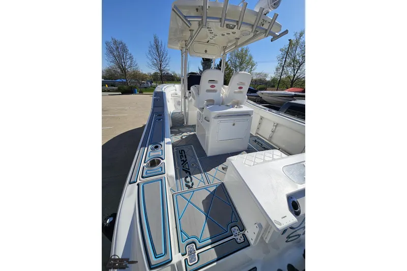 Slide: The Image of 2013 Sea Fox 286 Commander boat interior with seating and deck details. - 52