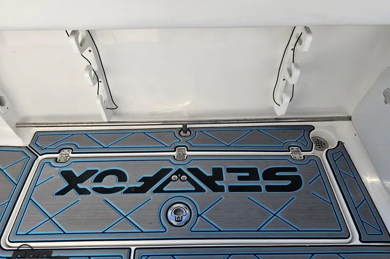 Slide: The Image of 2013 Sea Fox 286 Commander boat deck with custom blue and gray flooring. - 56