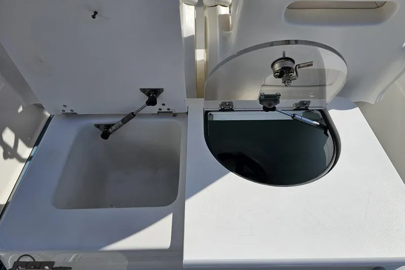 Slide: The Image of Open compartments on a 2013 Sea Fox 286 Commander boat, showcasing storage and functionality. - 59