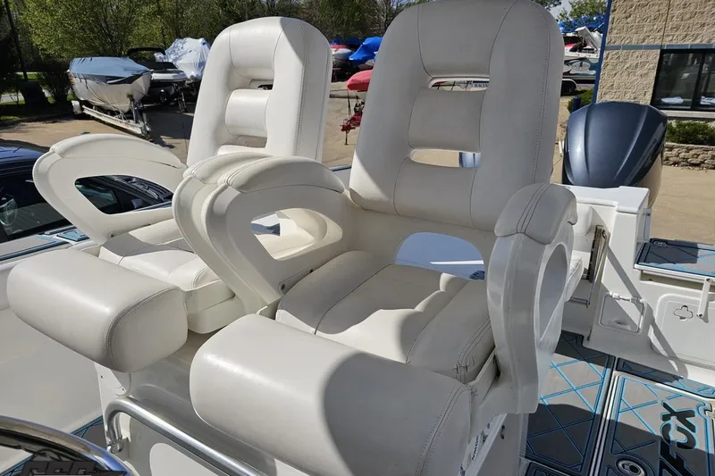 Slide: The Image of 2013 Sea Fox 286 Commander boat with dual white captain's chairs on deck. - 66