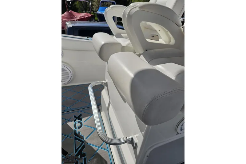 Slide: The Image of Interior of 2013 Sea Fox 286 Commander boat, featuring cushioned seating and sleek design elements. - 68