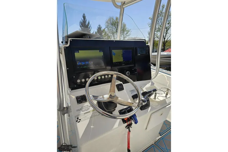 Slide: The Image of Steering console of 2013 Sea Fox 286 Commander boat with navigation screens. - 69