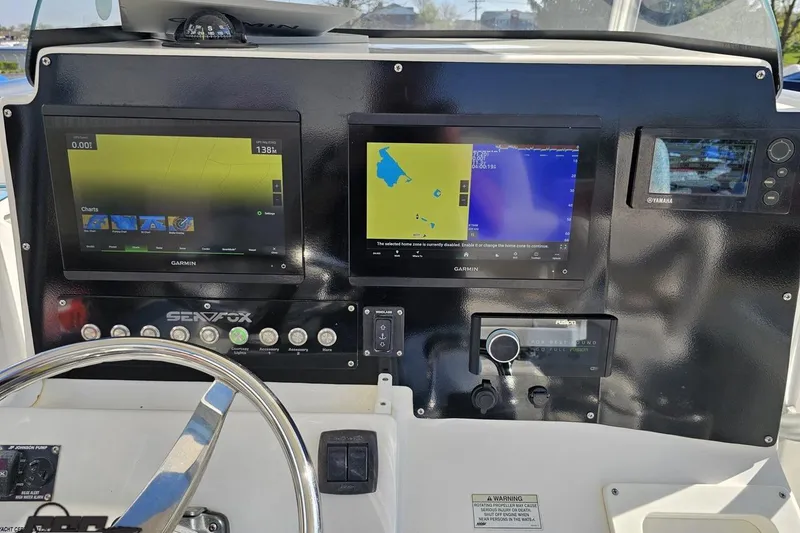 Slide: The Image of Control panel of a 2013 Sea Fox 286 Commander with Garmin navigation displays. - 71