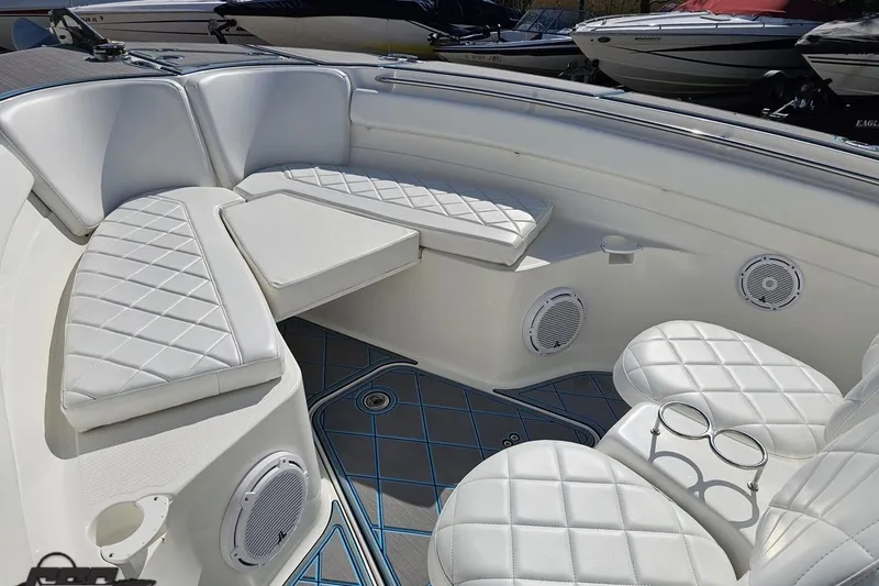 Slide: The Image of Luxurious seating area on a 2013 Sea Fox 286 Commander boat with white quilted upholstery. - 76