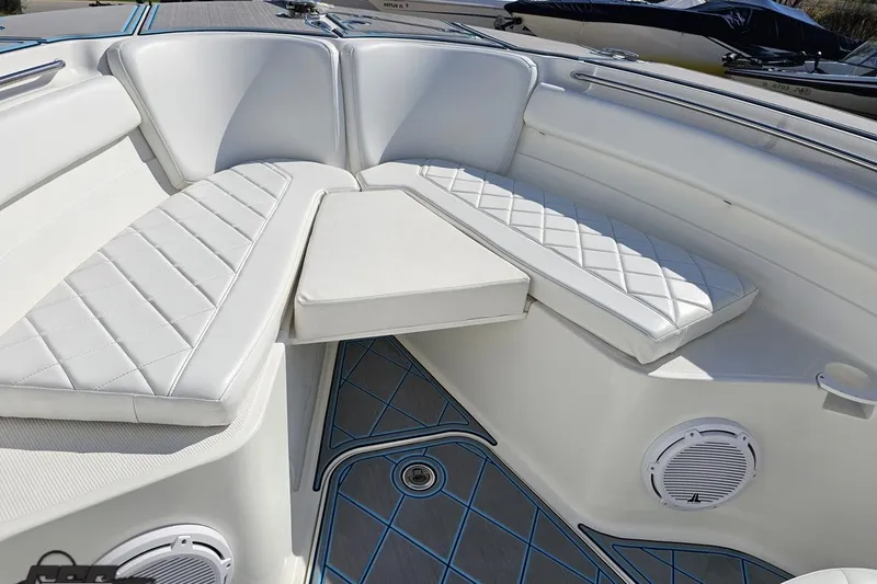 Slide: The Image of Luxurious seating area on a 2013 Sea Fox 286 Commander boat with white upholstery. - 77