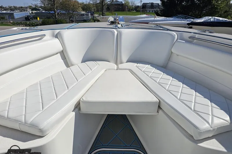 Slide: The Image of 2013 Sea Fox 286 Commander boat interior with white cushioned seating. - 80