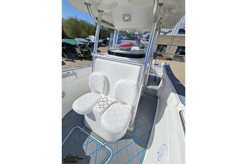 Slide: The Image of 2013 Sea Fox 286 Commander boat interior with white seating and modern design. - 91