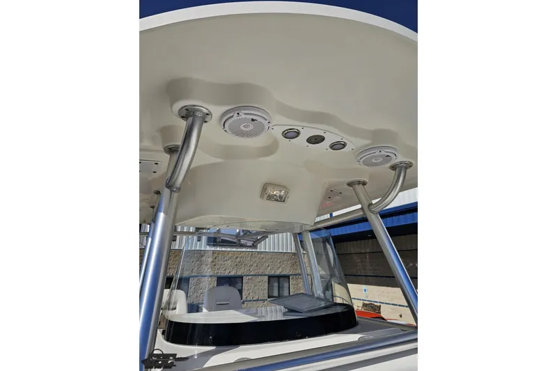 Slide: The Image of 2013 Sea Fox 286 Commander boat with T-top and mounted speakers. - 94
