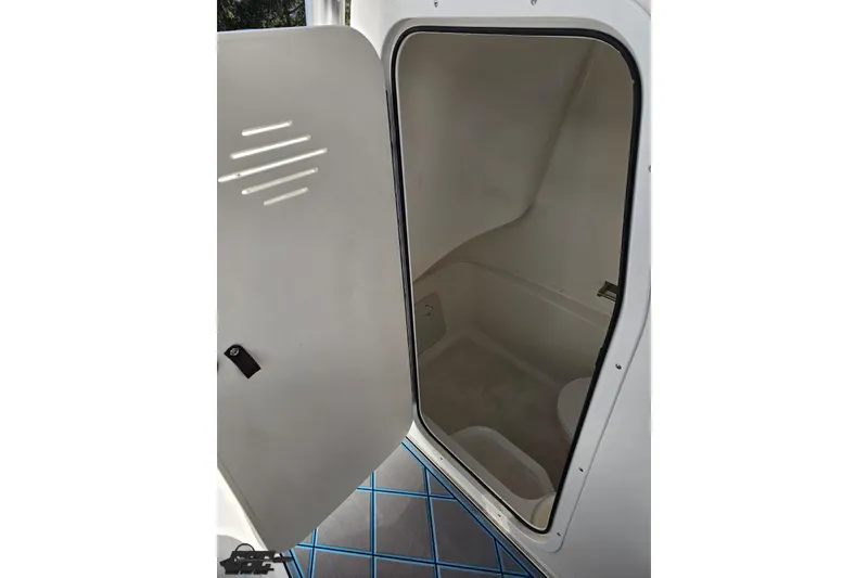 Slide: The Image of Interior view of 2013 Sea Fox 286 Commander boat compartment with open door. - 96