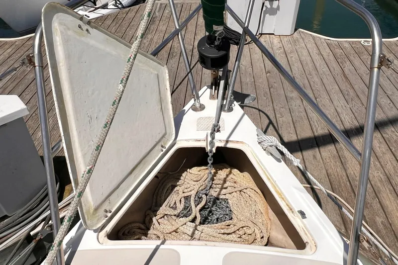 Slide: The Image of Anchor locker of a 1984 Catalina 30 sailboat with rope and chain. - 10