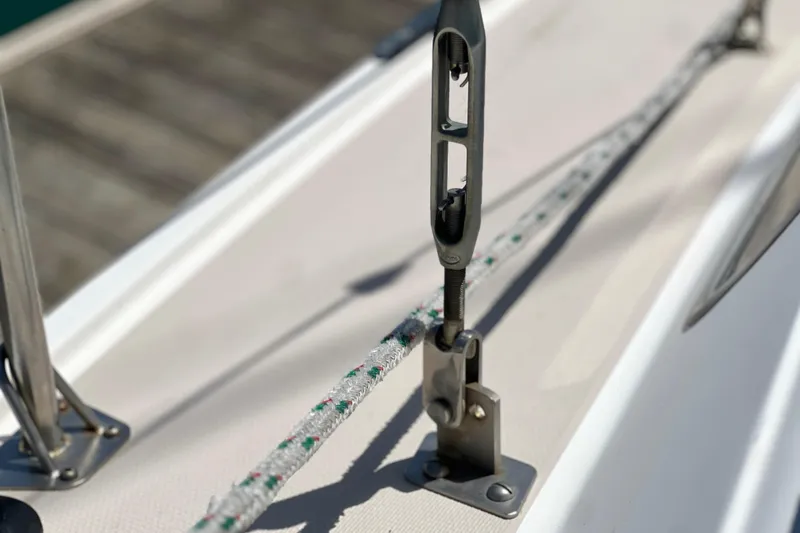 Slide: The Image of Close-up of rigging hardware on a 1984 Catalina 30 sailboat deck. - 12