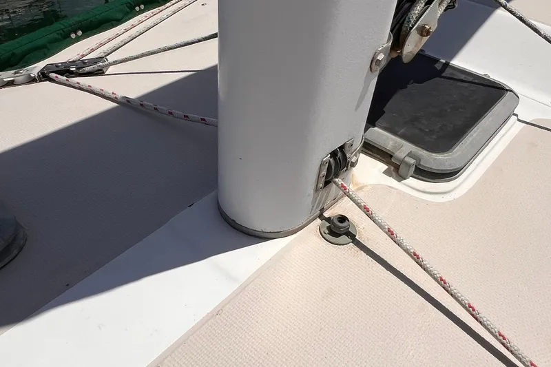 Slide: The Image of Deck of 1984 Catalina 30 sailboat showing mast base and rigging details. - 13