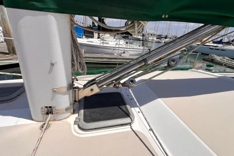 Slide: The Image of 1984 Catalina 30 sailboat deck with rigging and mast details at marina. - 14