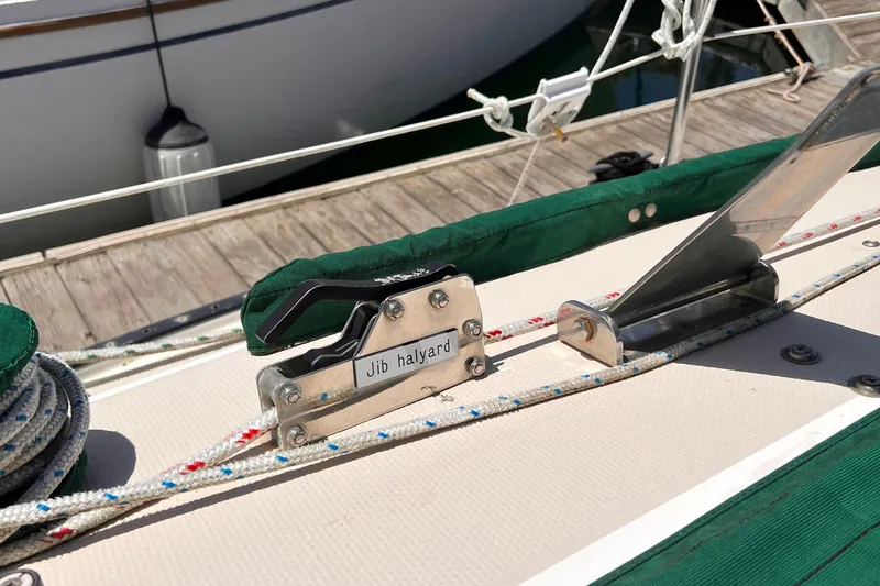 Slide: The Image of Jib halyard mechanism on 1984 Catalina 30 sailboat deck, docked at marina. - 18