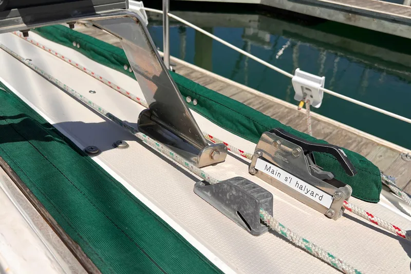 Slide: The Image of Close-up of 1984 Catalina 30 sailboat's main sail halyard mechanism. - 19