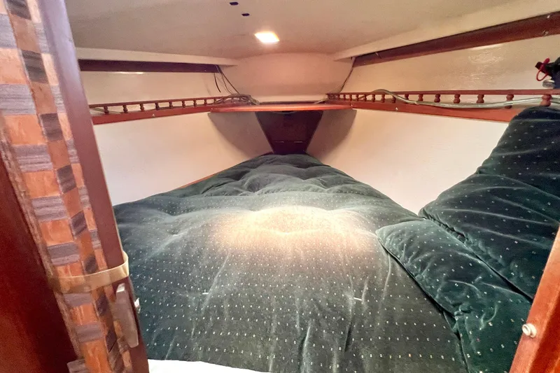 Slide: The Image of Interior of a 1984 Catalina 30 with cozy sleeping area. - 43