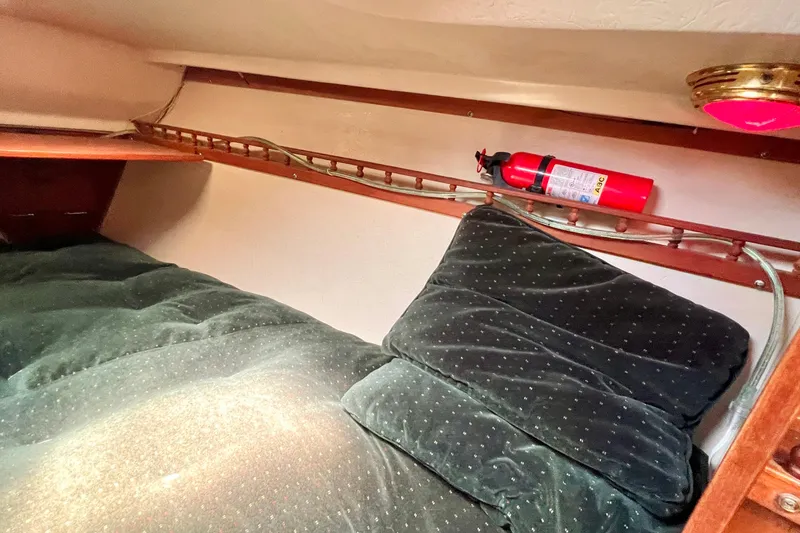 Slide: The Image of Cozy cabin interior of 1984 Catalina 30 sailboat with fire extinguisher. - 45