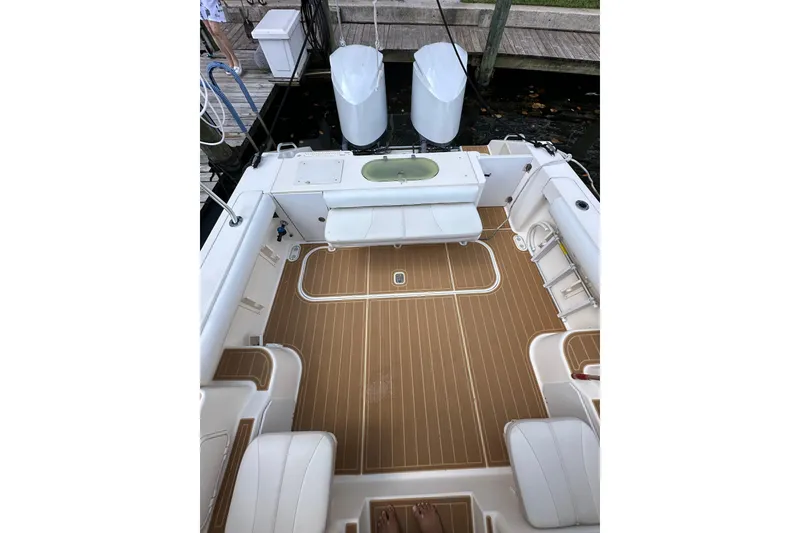 Slide: The Image of 2008 Pursuit OS 335 Offshore boat deck with seating and storage compartments. - 12